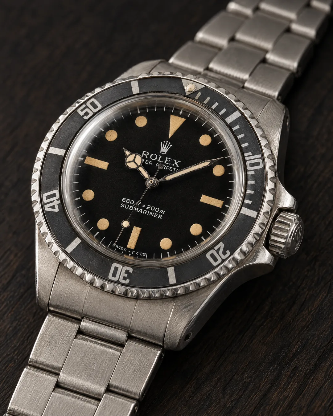 A vintage Rolex Submariner with a black dial and a stainless-steel Oyster bracelet
